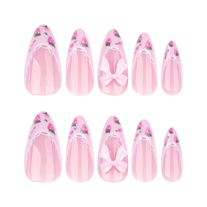 Artful stiletto nails with floral accents and bow embellishments Kalsten