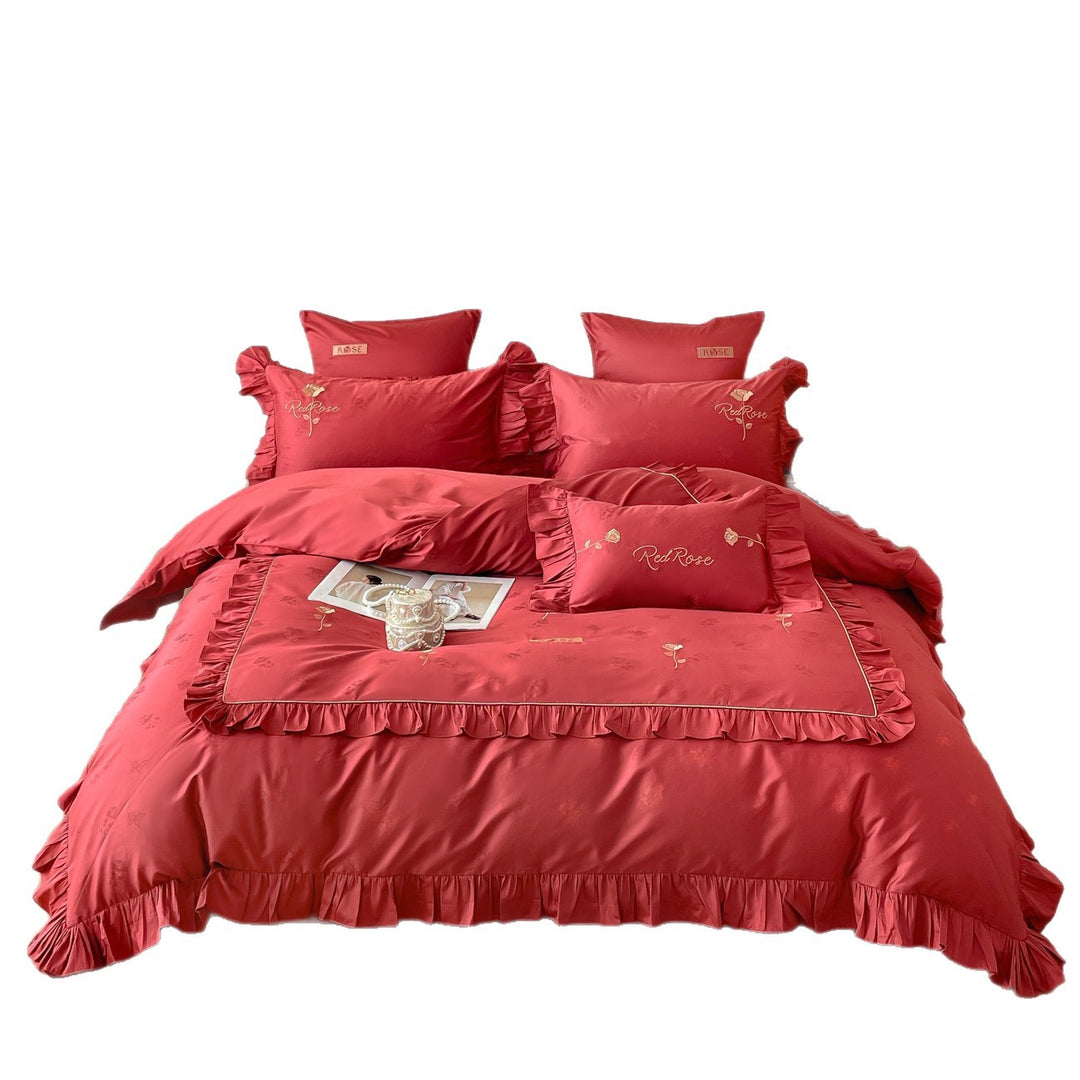 Romantic satin bedding set with ruffles, fine floral embroidery, and reversible pillowcase