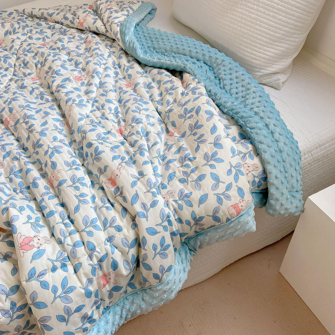 Cozy baby quilt with minky fleece border and cute rabbit print