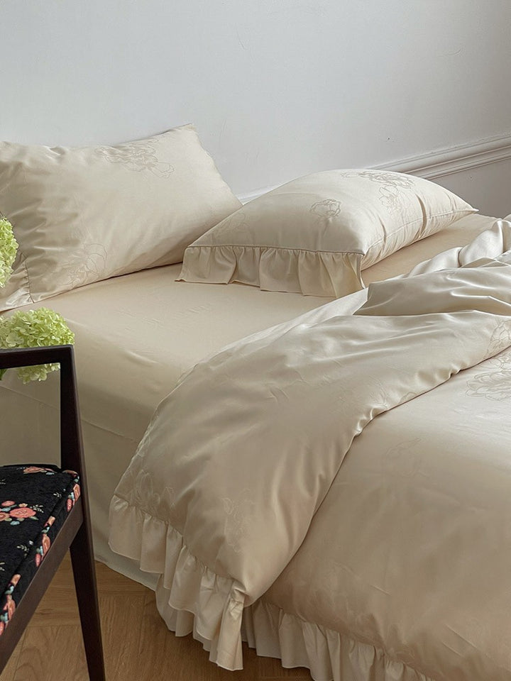 Bedding set made of cotton satin with ruffle, subtle jacquard floral relief and silky-matt finish