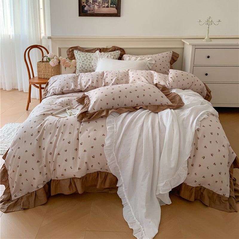 Romantic bed linen complete set made of cotton percale with delicate floral print, ruffle trim, and silky-matte finish