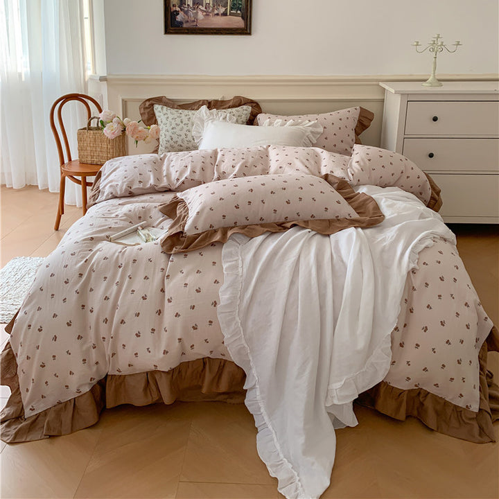Romantic bed linen complete set made of cotton percale with delicate floral print, ruffle trim, and silky-matte finish