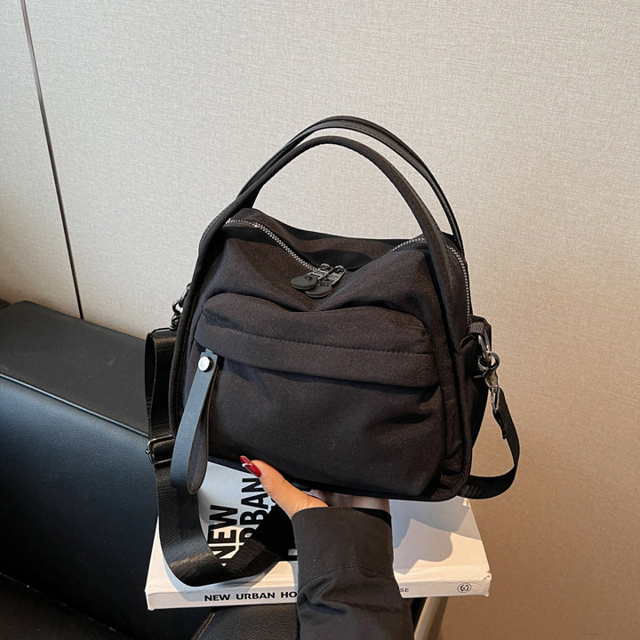 Fashionable shoulder bag with innovative structure and detachable carrying strap Kalsten