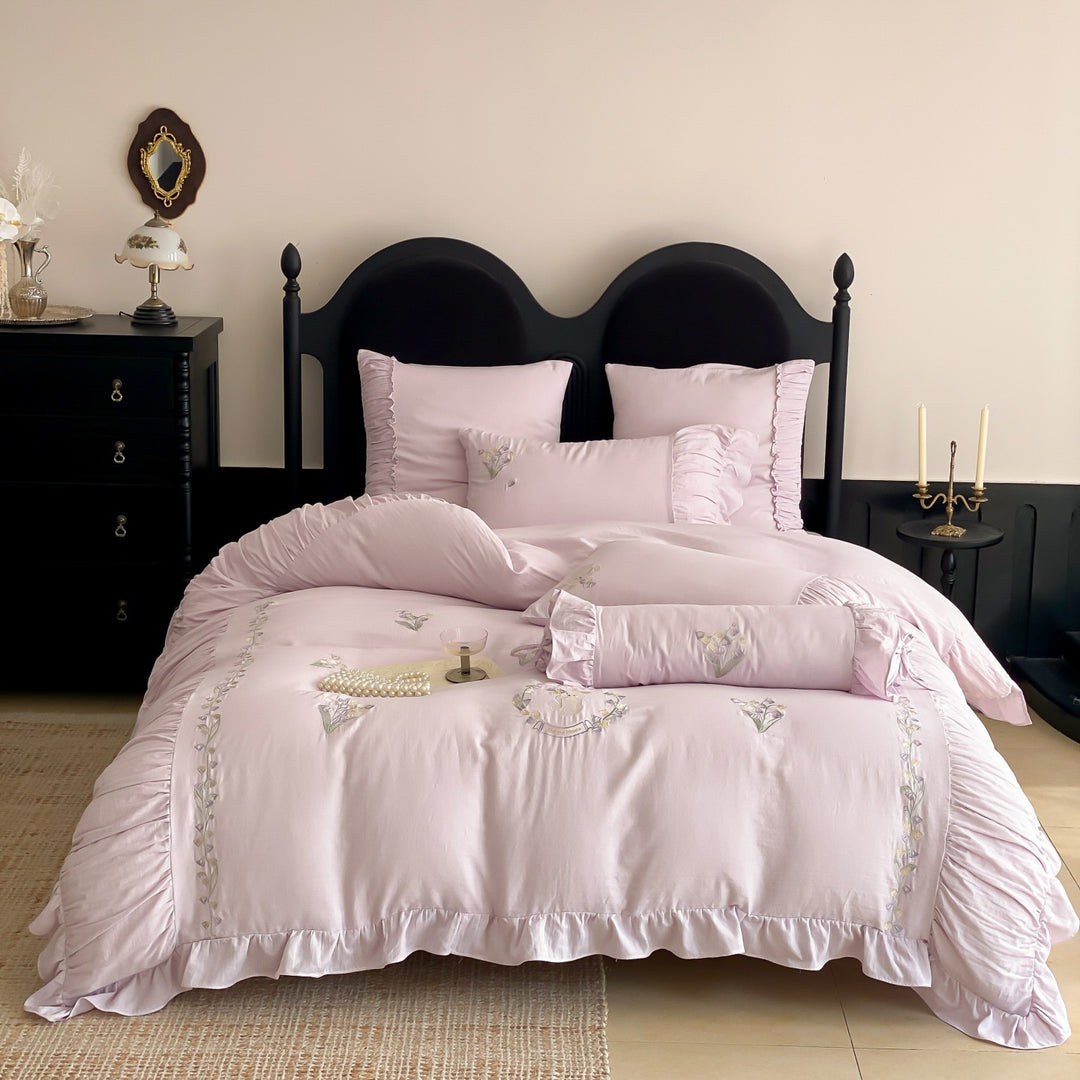 Premium bed linen set made of cotton percale with fine ruffle trim and embroidered calla motifs