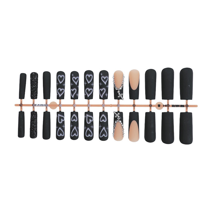 Artificial nail set with elegant glitter and heart designs Kalsten