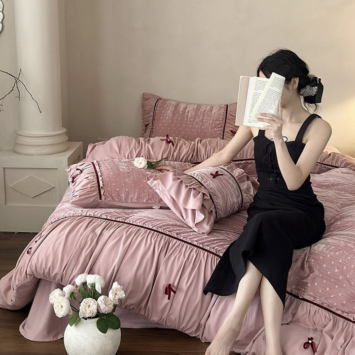 Bedding set made of velvety microfiber with ruffles, decorative ribbons, and quilted texture