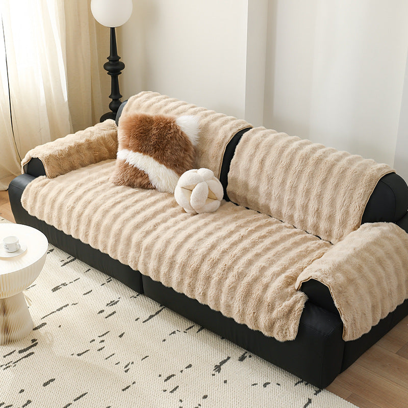 Luxurious sofa cover made of faux fur with ribbed texture