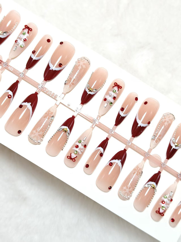 Artificial nails with festive designs and glitter accents Kalsten