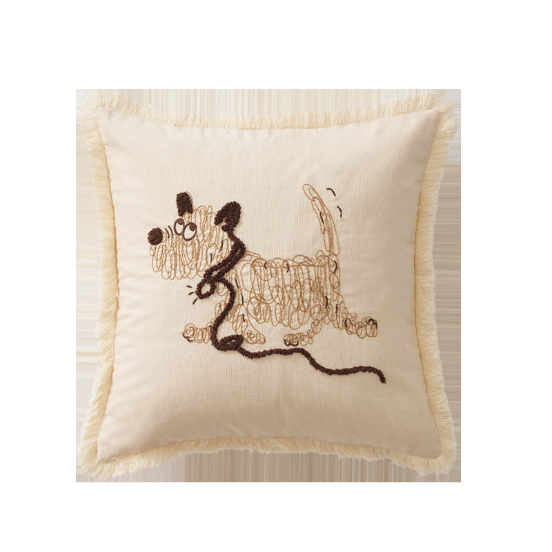 Decorative cushion cover with embroidered dog motif and fringed border