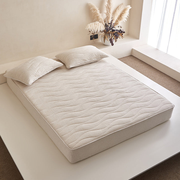 Quilted mattress topper with all-around fitted edge and breathable padding