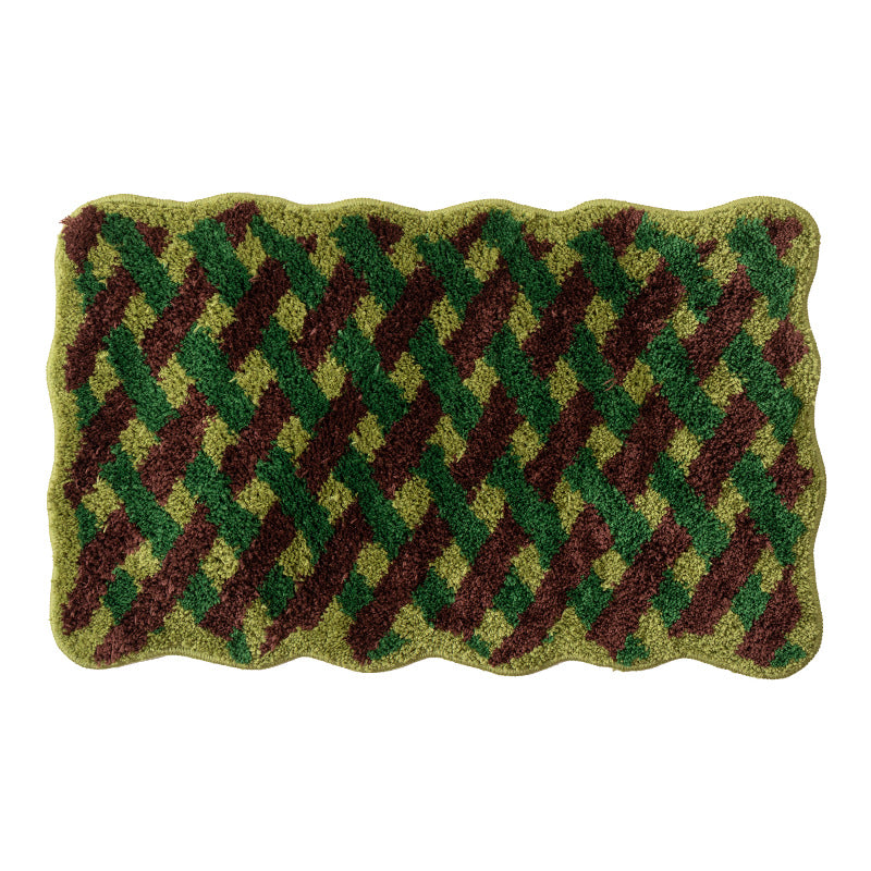 Tufted bathroom mat with wavy edge and geometric relief