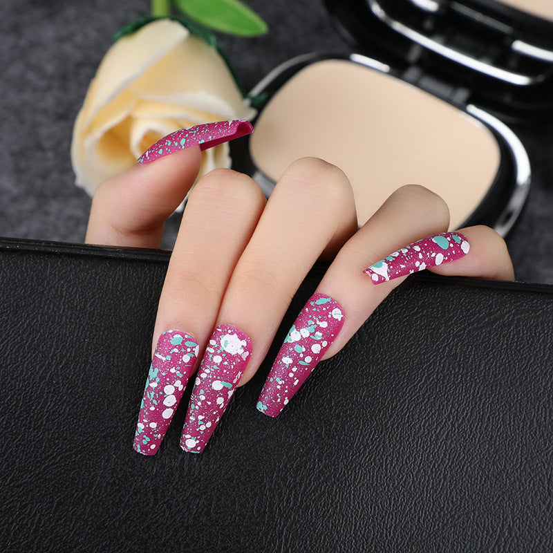 Artistic splatter design artificial nails Kalsten