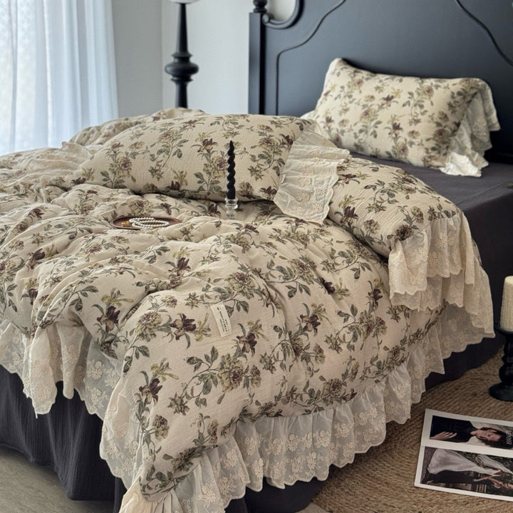 Floral quilted comfort bedspread with lace trim and decorative ruffle