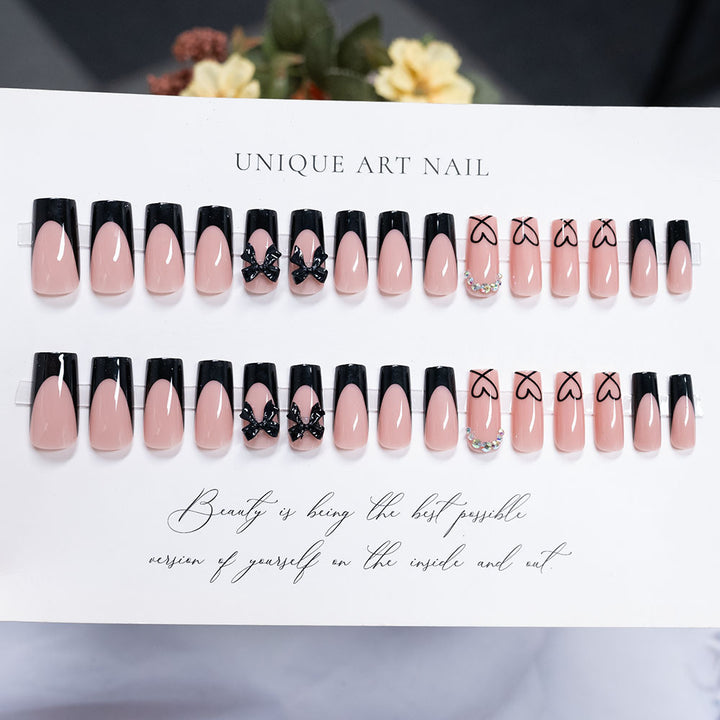 Decorative Long-Stiletto Press-On Nails with Heart and Bow Design