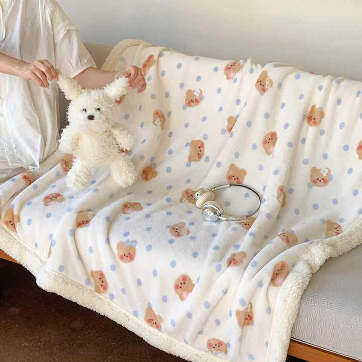 Reversible fleece blanket with cartoon cat design and teddy lining