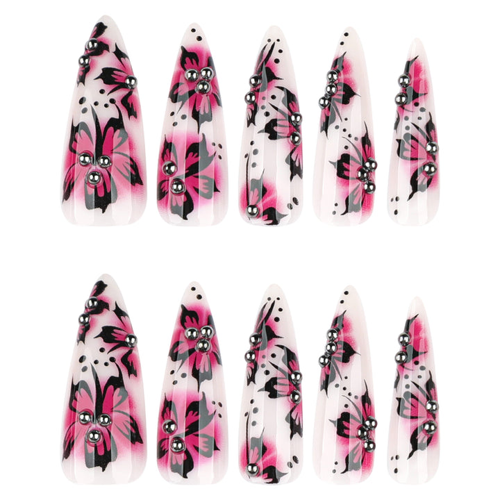 Artful nail art with floral design and rhinestone accents Kalsten