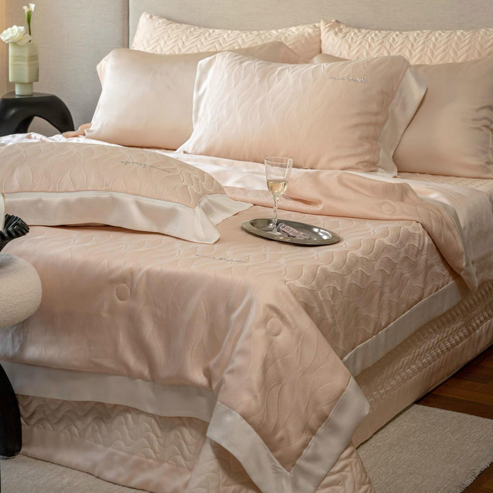 Luxurious quilt bedding set made of satin with embossed wave relief and satin border