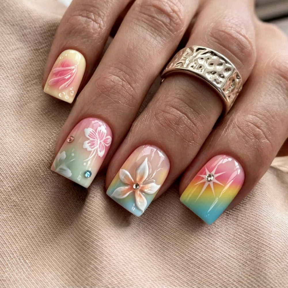 Artificial nails in vibrant floral design with glitter accents Kalsten