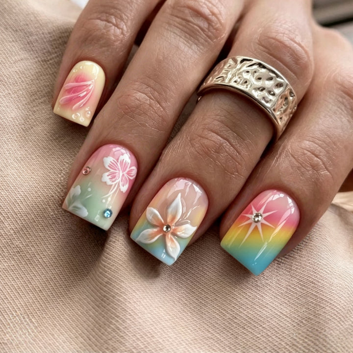 Artificial nails in vibrant floral design with glitter accents Kalsten