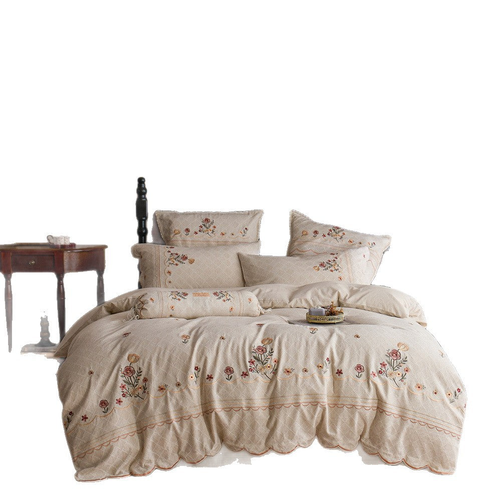 Luxurious embroidered cotton bedding set with ruffle and decorative pillow