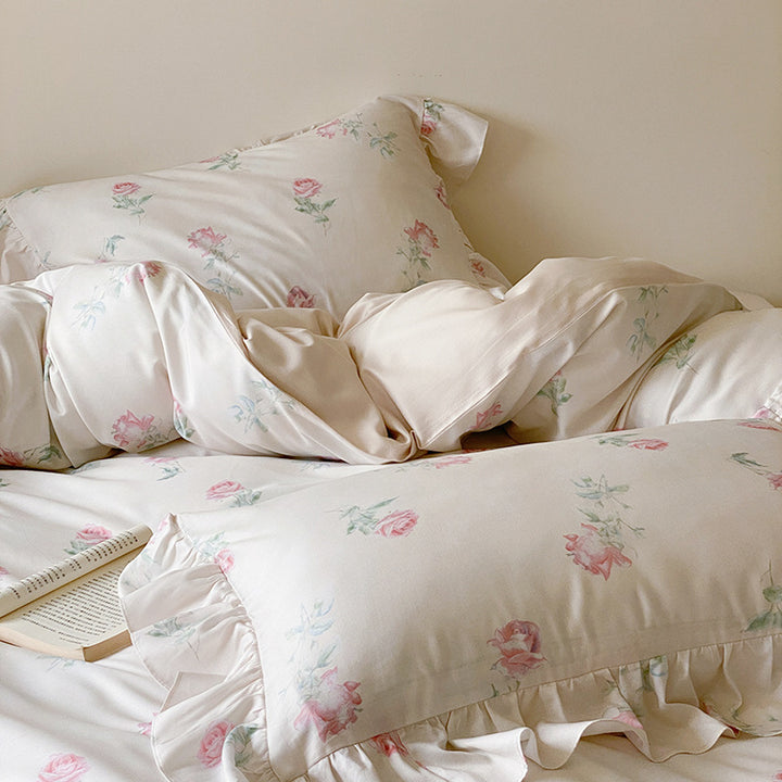 Luxurious satin bedding set with delicate rose pattern and ruffled hem
