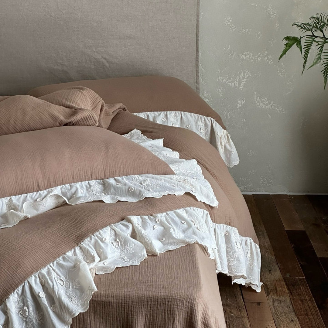 Quilted cotton duvet with embroidered frill and layered ruffled bed skirt