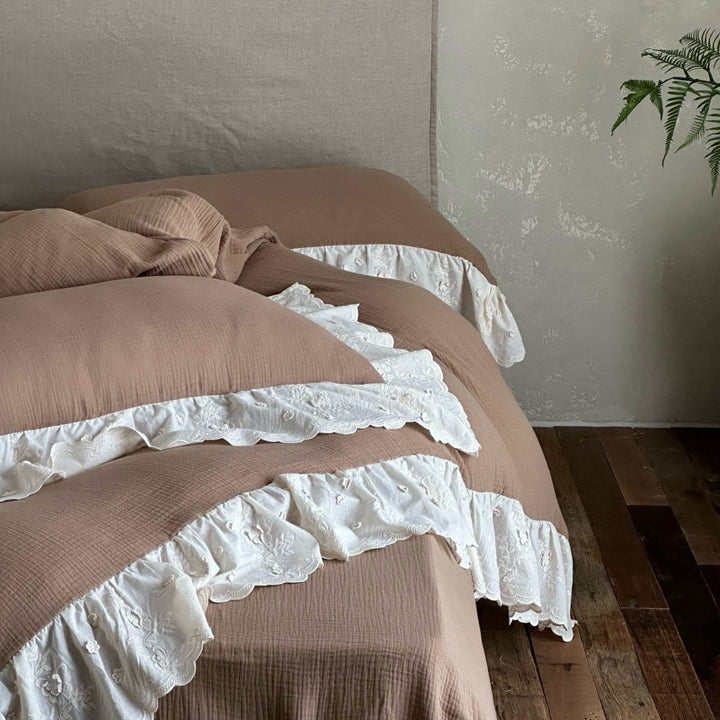 Quilted cotton duvet with embroidered frill and layered ruffled bed skirt