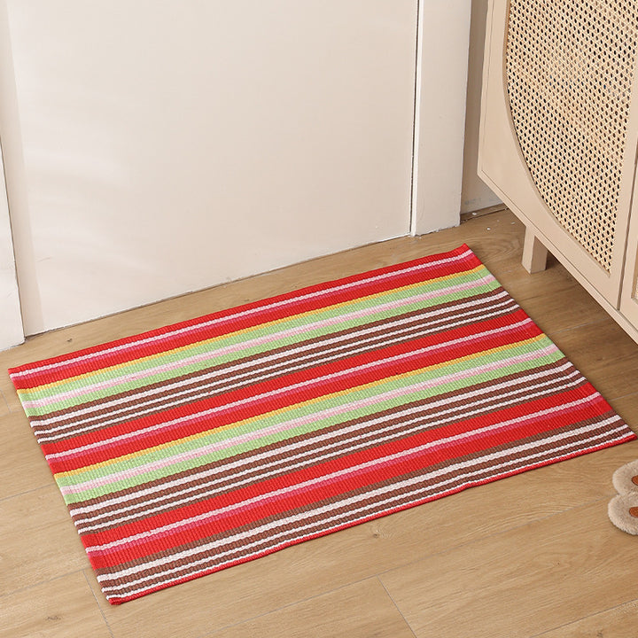 Striped cotton doormat with non-slip bottom and decorative woven edge Kalsten