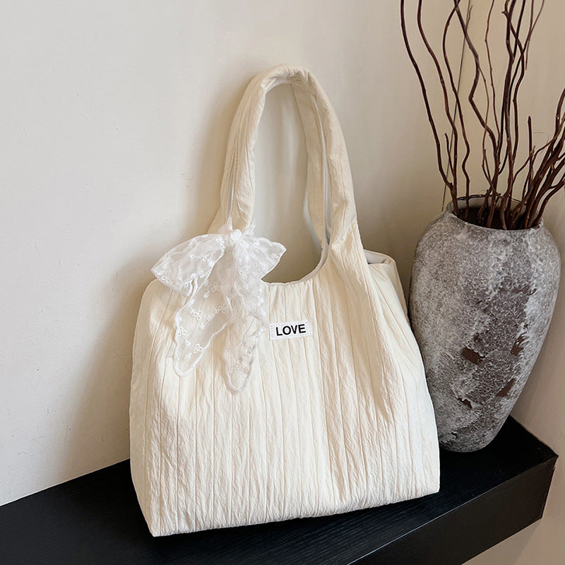Leisure bag with structured design and playful scarf Kalsten