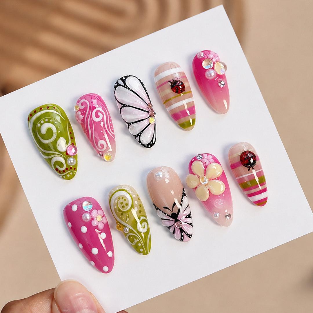 Artificial nail set with playful floral and glitter motifs Kalsten
