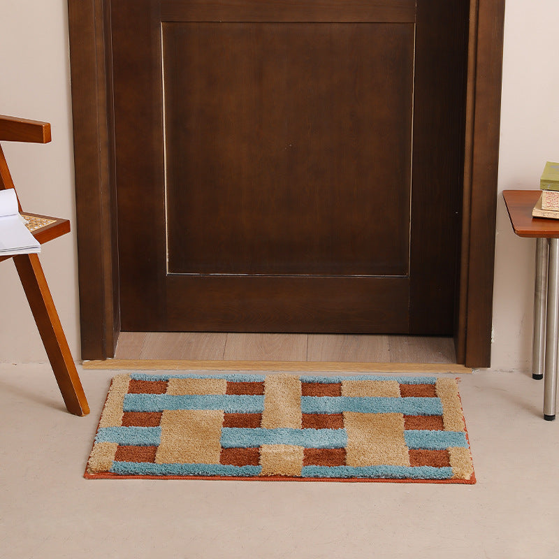 Rectangular tufted door mat with geometric block pattern and non-slip backing Kalsten