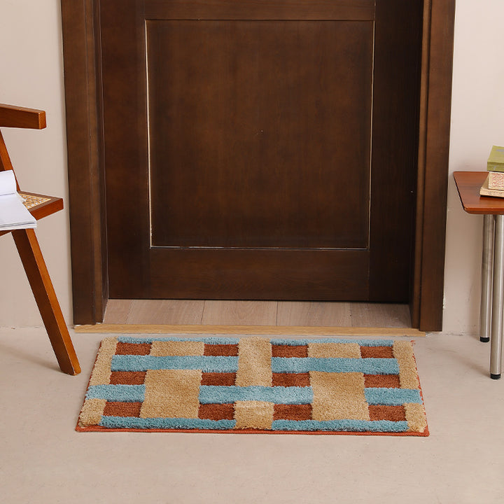 Rectangular tufted door mat with geometric block pattern and non-slip backing Kalsten