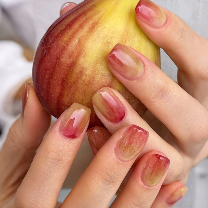 Acrylic nail set with elegant color gradients and creative accents Kalsten