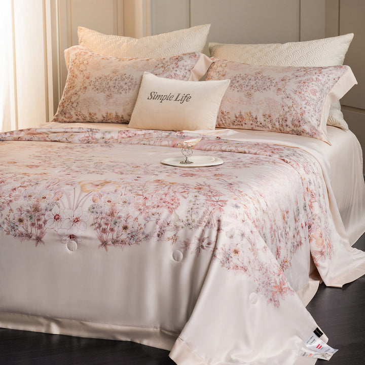 Luxurious cotton satin bed linen set with delicate floral print and quilted bedspread