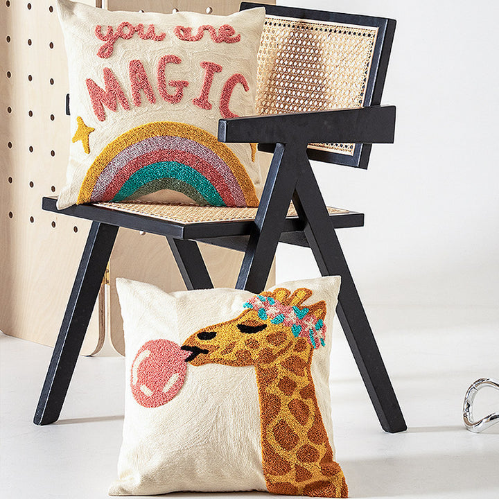 Decorative pillowcase with hand-tufted giraffe and rainbow motif