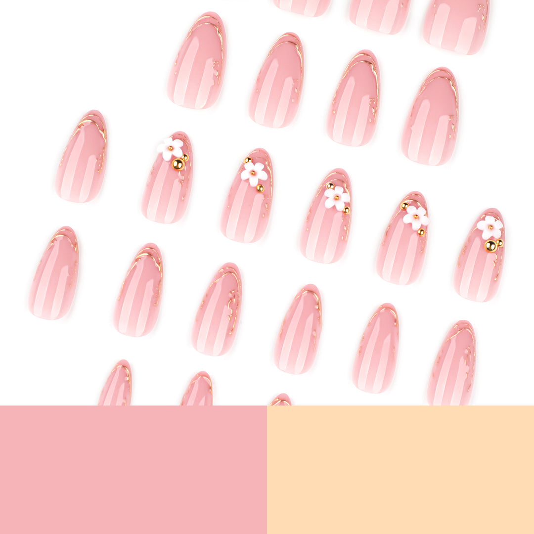 Artful nail design with golden accents and floral details Kalsten