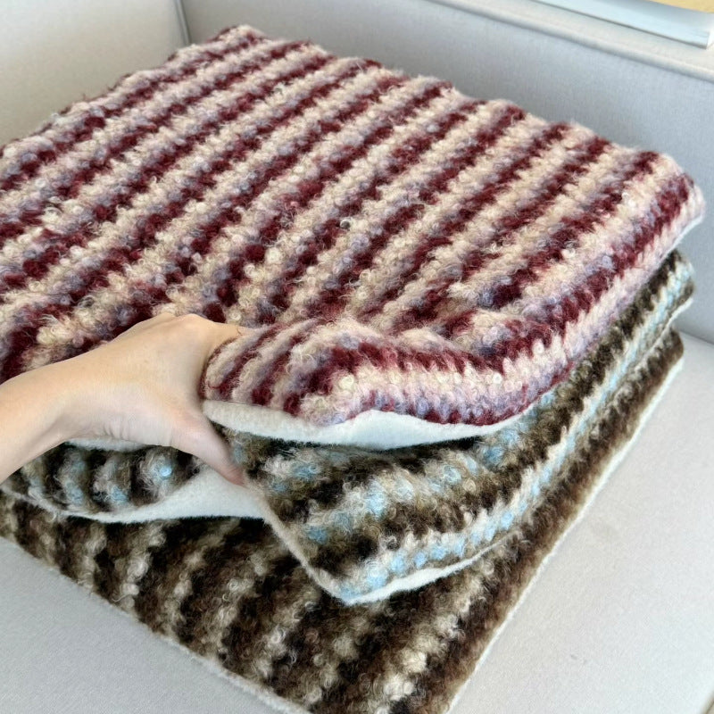 Knitted decorative cushion with wool blend and retro stripe texture
