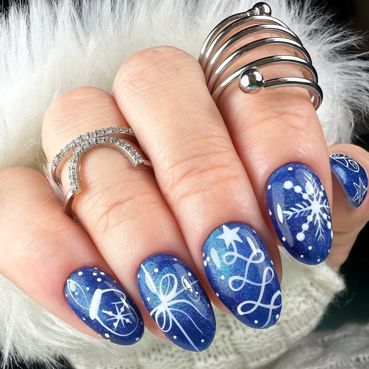 Artificial nails in festive winter design with glittering snowflakes and elegant decorations Kalsten
