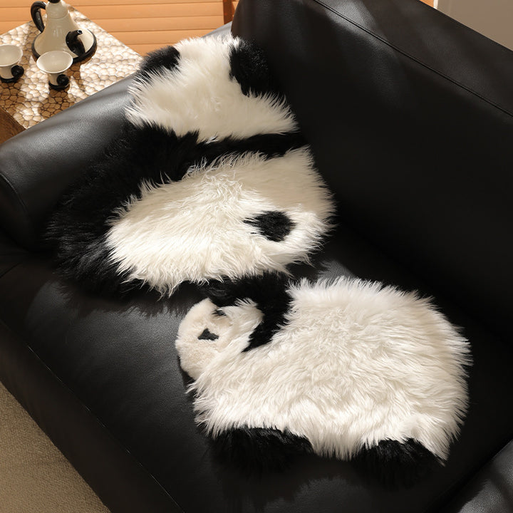 Plush seat pouf in sheep shape with cuddly faux fur cover