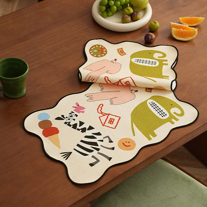 Playful shaped table runner with colorful animal illustrations and decorative edge