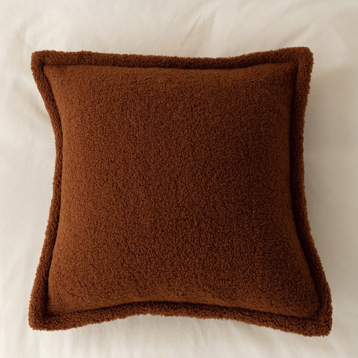 Decorative teddy fleece cushion with padded filling and piped seam