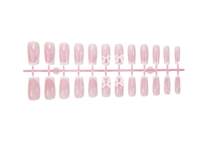 Glamorous artificial nail set with elegant bows and glitter accents Kalsten