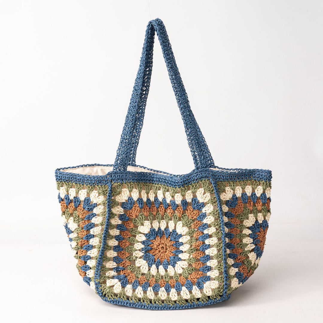 Beach bag made of hand-woven natural material with a square pattern Kalsten