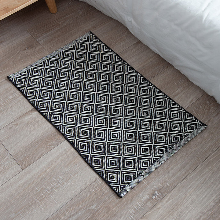 Striped cotton doormat with non-slip bottom and decorative woven edge Kalsten