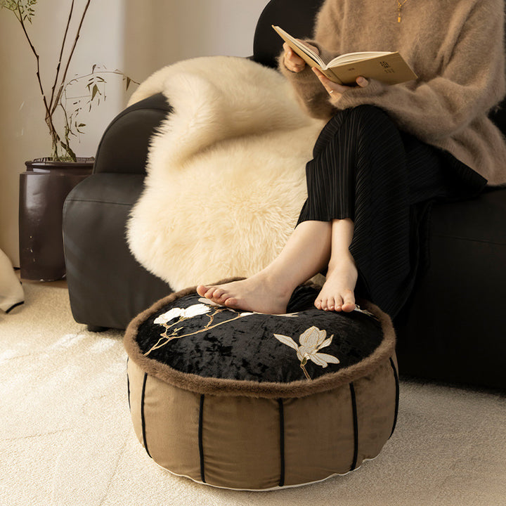 Seat pouf made of embroidered velvet with faux fur trim