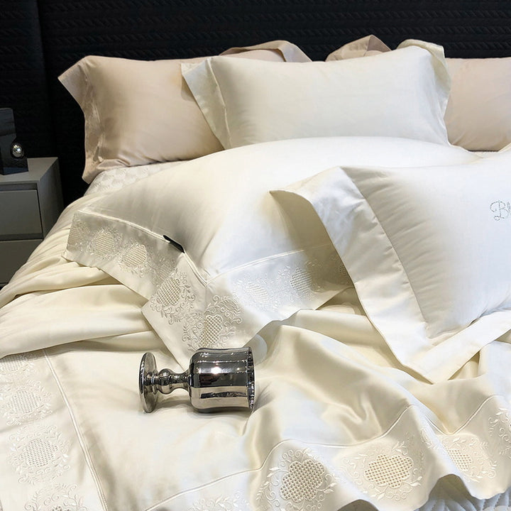 High-gloss satin bed linen set with floral cutwork embroidery border
