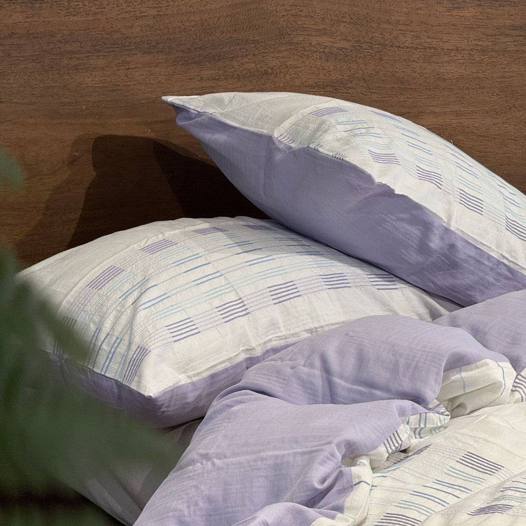 Cotton percale bedding set with a light quilted texture and subtle striped texture