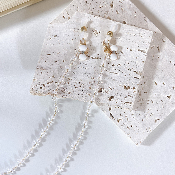 Elegant earrings with pearls and flower pendants Kalsten