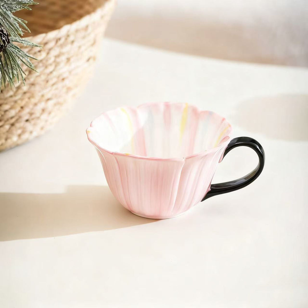 Handcrafted ceramic mug with shell-shaped wave edge and contrasting handle