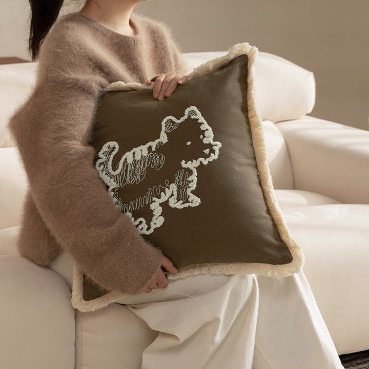 Decorative cushion cover with embroidered dog motif and fringed border